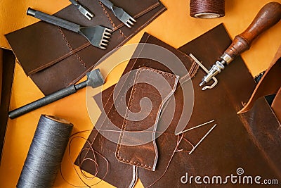 Leather and craft tools on table, top view Stock Photo