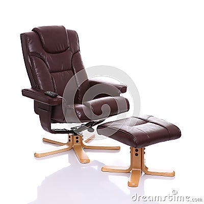 Leather heated recliner chair with footstool Stock Photo