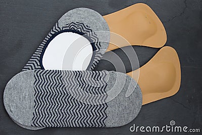 Leather orthopedic insoles with socks. Stone background. Top vie Stock Photo