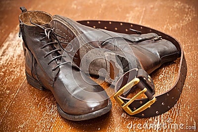 Leather shoes and a leather belt with buckle. Stock Photo
