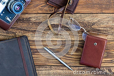 Leather vintage Items and Photo camera on Wood Background Stock Photo