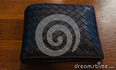 Leather wallet black leather on the wood background Stock Photo