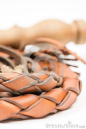 Leather whip isolated over white background closeup macro Stock Photo