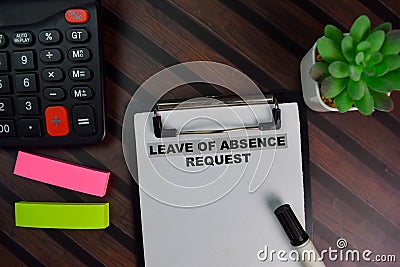 Leave of Absence Request write on a paperwork isolated on Wooden Table Stock Photo