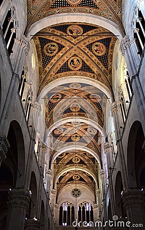 It leaves, towards the entrance, of the central frescoed nave of the cathedral of Lucca, illuminated by the light that enters thro Stock Photo