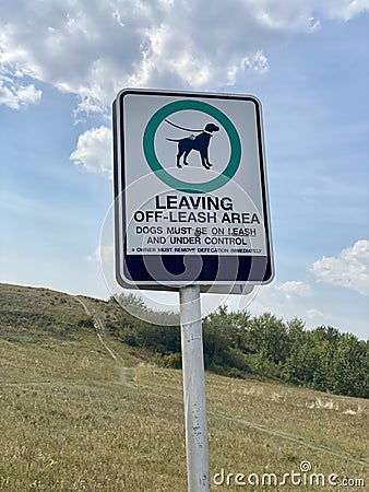 Leaving Off-Leash Area sign. Dogs must be under control on leash and under control. Editorial Stock Photo
