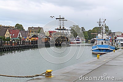 Leba, Poland - August 25, 2014 Editorial Fishing boats in port of Leba town over Baltic Sea coast Editorial Stock Photo