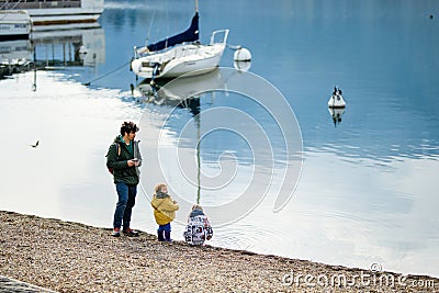 LECCO, ITALY - APRIL 2022: Tourists and locals spending sunny spring day in Lecco, a town on the shore of Lake Como. Charming Editorial Stock Photo