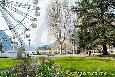 LECCO, ITALY - APRIL 2022: Tourists and locals spending sunny spring day in Lecco, a town on the shore of Lake Como. Charming Editorial Stock Photo