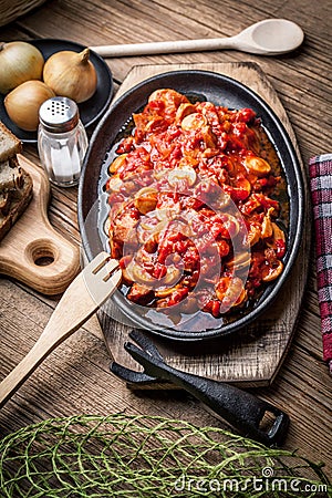 Lecho - stew with peppers, onions and sausages. Stock Photo