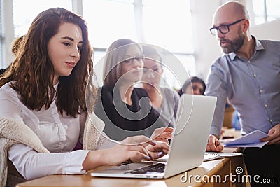 Lecturer and multinational group of students in an auditorium Stock Photo