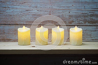 LED Candle Light electronic on wooden background Stock Photo