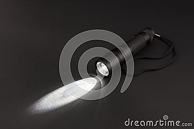 LED flashlight with a light beam Stock Photo