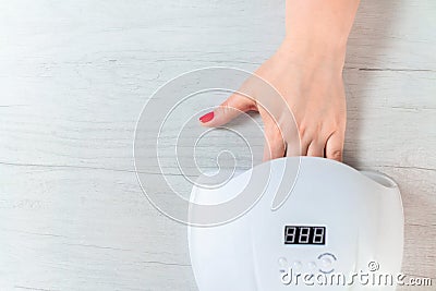 LED lamp for nails. Manicure at home. Stock Photo