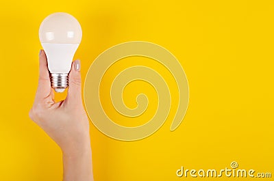 LED light bulb composition on yellow background Stock Photo