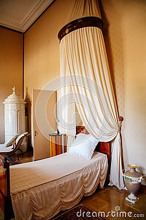 Lednice, Southern Moravia, Czech Republic, 04 July 2021: Castle interior with baroque wooden carved furniture, bedroom with canopy Editorial Stock Photo