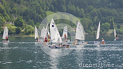 Ledro, Italy. Sailing school on small boats. School on Lake Ledro. Alpine lake. Summer time Editorial Stock Photo