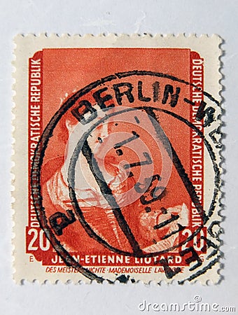 An old red east german postage stamp with an image of the artist Jean-Ã‰tienne Liotard Editorial Stock Photo