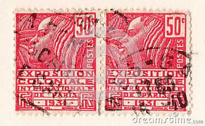 Old red french postage stamp with an illustration of a stylized african woman commemorating a colonial exhibition in 1931 Cartoon Illustration