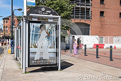 Wallis female ladies fashion clothing poster advert on the side of a bus stop Editorial Stock Photo