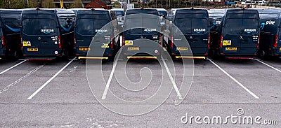 Row of new Ford E-Transit vans with Amazon Prime livery Editorial Stock Photo