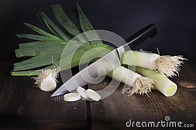 Leeks and Chefs Knife Stock Photo