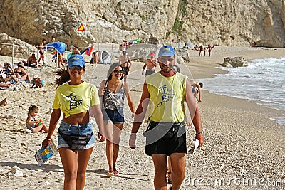 Lefkada, Greece July 16 2018, Beach attendants at work on the beach and at the turquoise sea of Porto Katsiki Editorial Stock Photo