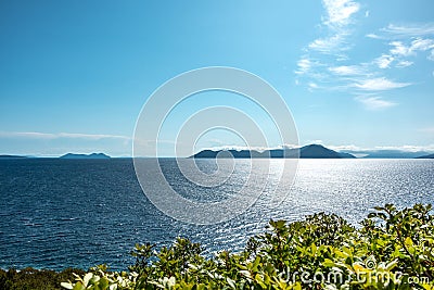 Lefkada sea shore cliffs with vivid greenery view Stock Photo