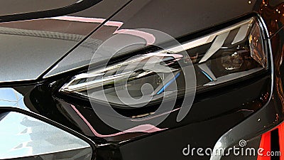 Left headlight of german battery electric executive car Audi RS e-tron GT displayed on motorshow in Bratislava, Slovakia. Editorial Stock Photo