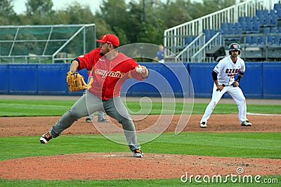 Lefthanded Spanish pitcher playing a pickoff. Editorial Stock Photo