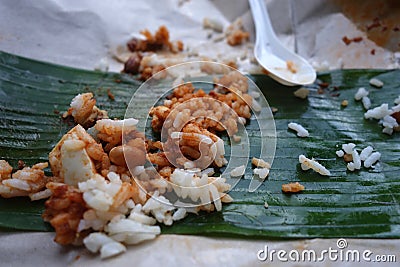 Leftover rice on banana leave Stock Photo