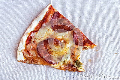 Leftovers of pizza on a napkin. Stock Photo