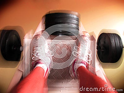 Leg press movement Stock Photo