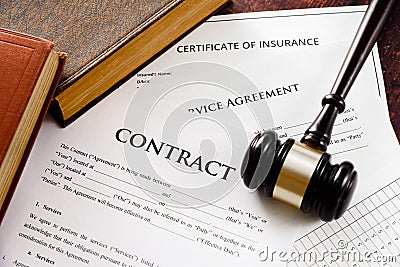 Legal contracts are subject to commercial disputes resolved in the courts of justice, contract with gavel Stock Photo