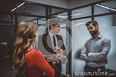 Lawyer talking to a couple demanding the divorce Stock Photo