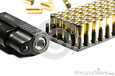 Legalization of weapons. The legal traumatic short-barrel weapon lies on a white background next to the cartridges Stock Photo