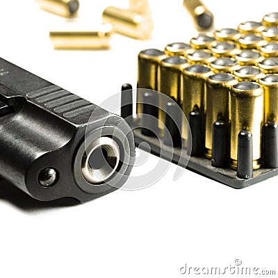 Legalization of weapons. The legal traumatic short-barrel weapon lies on a white background next to the cartridges Stock Photo