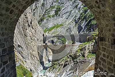 Legendary Devil`s Bridge built by devil himself over Schollenen Gorge in Andermatt Stock Photo