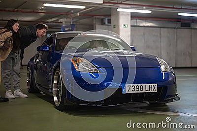 legendary Japanese sports car, the Nissan 350Z in blue tuned with lowered suspension Editorial Stock Photo
