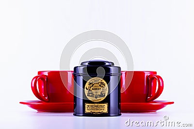 Legendary Marco Polo tea in the black box and two red cups of tea Editorial Stock Photo