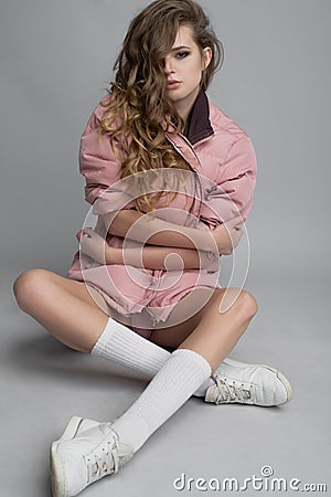 Leggy attractive model on grey background Stock Photo