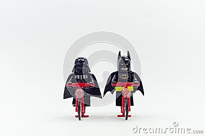 lego batman and darth vader riding bicycle together Editorial Stock Photo