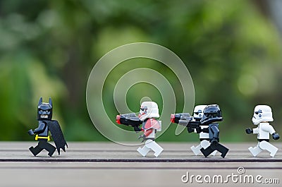 lego batman running from lego storm trooper. Editorial Stock Photo