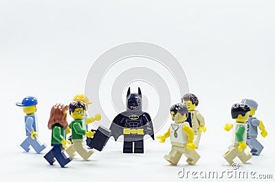 lego batman standing in the crowd of minifigures people Editorial Stock Photo