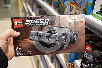 Lego constructor Fast Furious, 1970 Dodge Charger R T in hand of buyer in a Lego store. Minsk, Belarus, 2023 Editorial Stock Photo