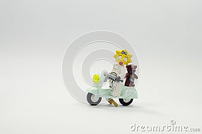 Lego maggie minifigures wearing starwars costume riding scooter with teddy bear Editorial Stock Photo