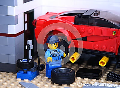 Lego mechanic minifigure changing a wheel on a Lego LaFerrari Editorial Stock Photo