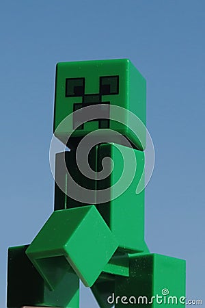 Lego Minecraft figure of Creeper green monster mob, walking forward Editorial Stock Photo