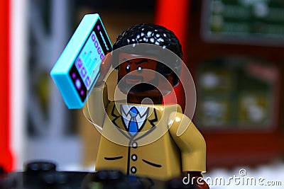 Lego mini-figure Guy making a phone call Editorial Stock Photo