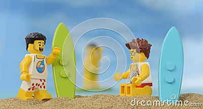 Lego minifigure surfer on sand beach with surf board Editorial Stock Photo